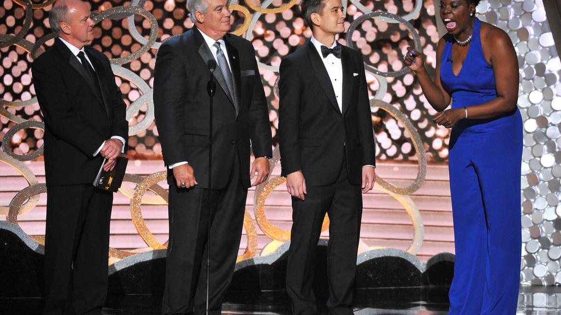 Leslie Jones, right, and accountants from Ernst & Young appear on stage at the 68th Primetime Emmy Awards on Sunday at the Microsoft Theater in Los Angeles.