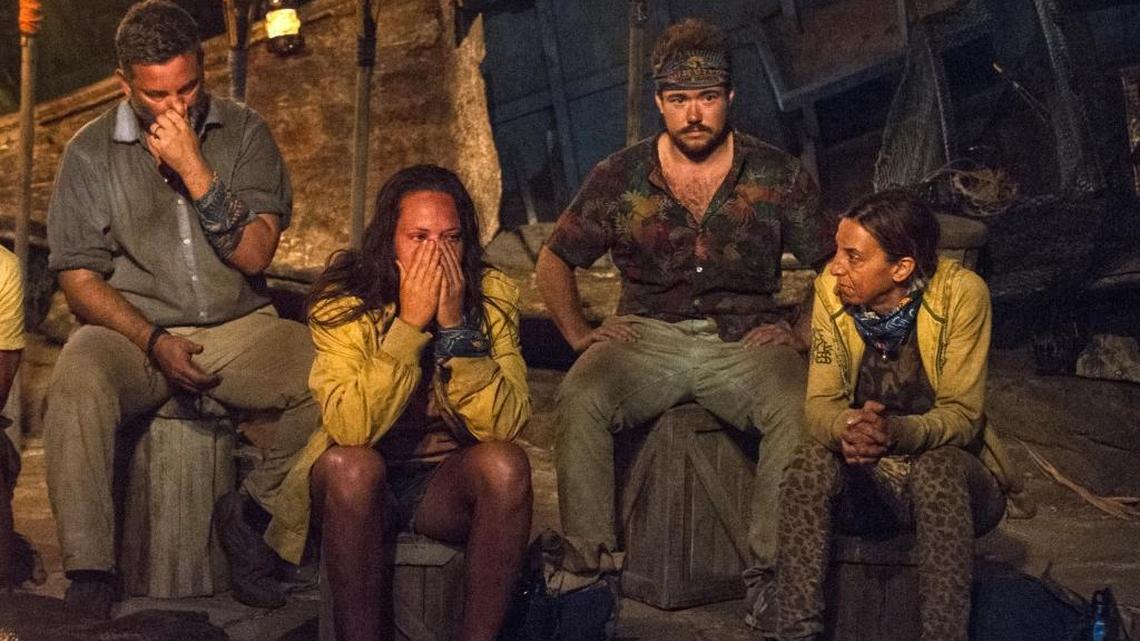 “Survivor: Game Changers” contestants, from left, Jeff Varner, Sarah Lacina, Zeke Smith and Debbie Wanner appear at the Tribal Council portion of the competition series. Smith was outed as transgender by fellow competitor Varner on Wednesday night’s episode. Varner was immediately criticized by other players. He repeatedly apologized, but was voted out of the competition.