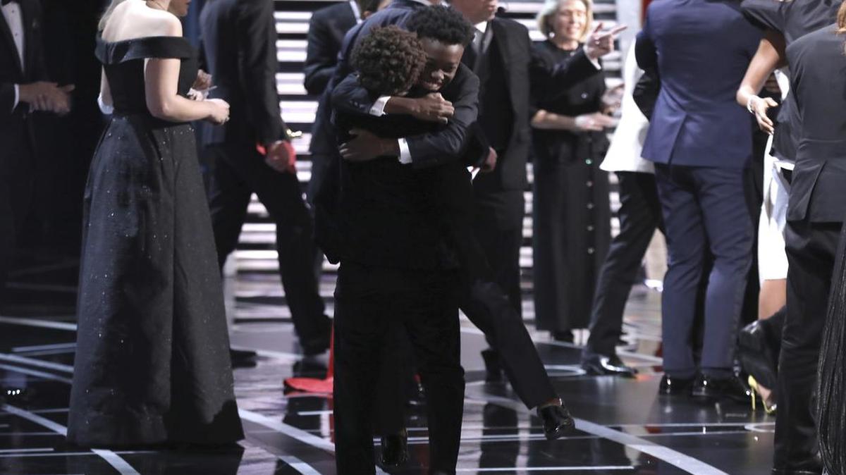 Jaden Piner and Alex R Hibbert embrace as "Moonlight" wins the best picture award at the Oscars on Sunday, Feb. 26, 2017, at the Dolby Theatre in Los Angeles.