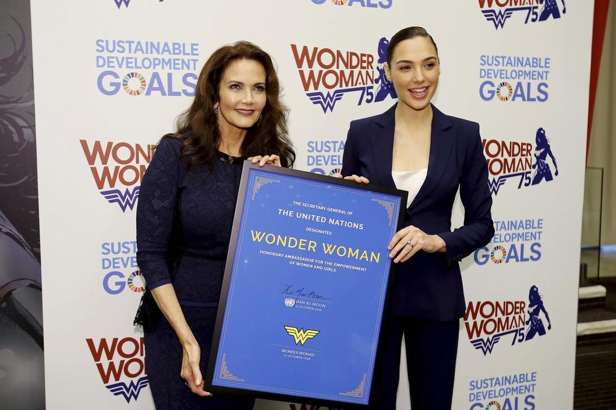 Lynda Carter, who starred in the 1970s TV series,"Wonder Woman," left, and actress Gal Gadot, who stars in the upcoming film, "Wonder Woman," appear at a United Nations event naming the super hero character as an Honorary Ambassador For the Empowerment of Women and girls, Oct. 21, 2016.