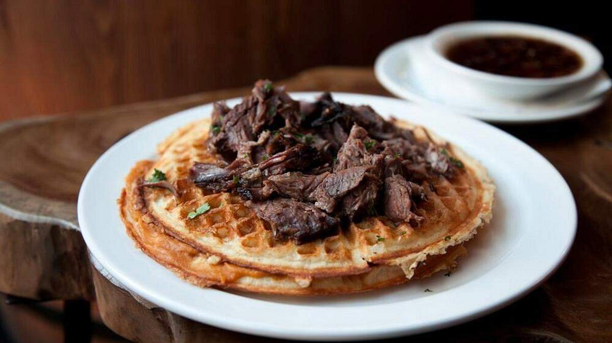 Brisket and waffles is one of the dishes served at Smoke Bourbon and BBQ, which will be open on the Fourth of July.