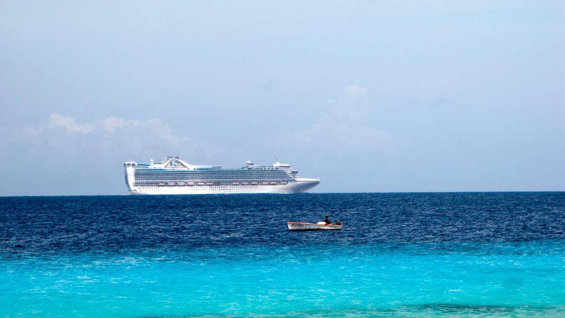 A Hunter College professor accused of using government grants to bankroll tropical vacations entered into a settlement with the federal government, officials said.