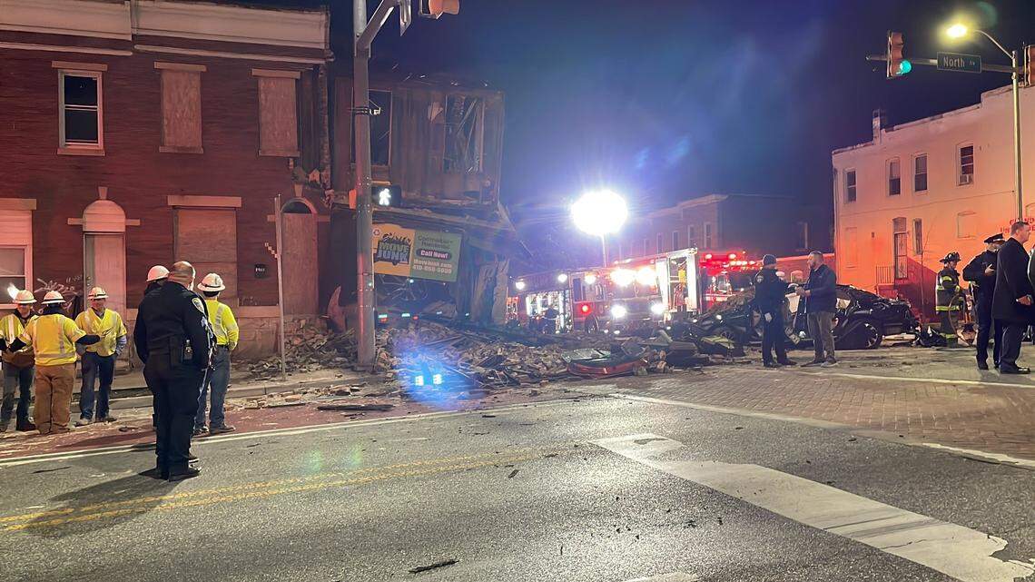 Two cars slammed into a building in Baltimore on Feb. 8, causing it to collapse, police said.