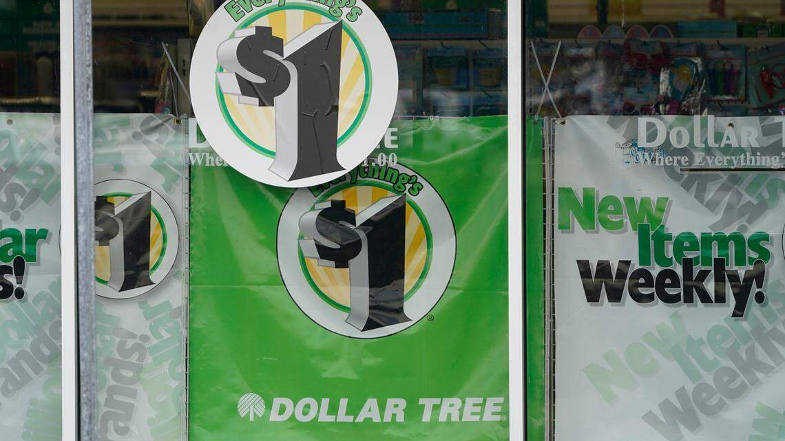In this Feb. 25, 2021 photo, Dollar Tree store logos are promoted on its storefront window in Jackson, Mississippi. The company announced on Nov. 23, 2021, that it will increase the price of most products to $1.25, a change that it says will help address increased freight and distribution costs and allow stores to offer more products.
