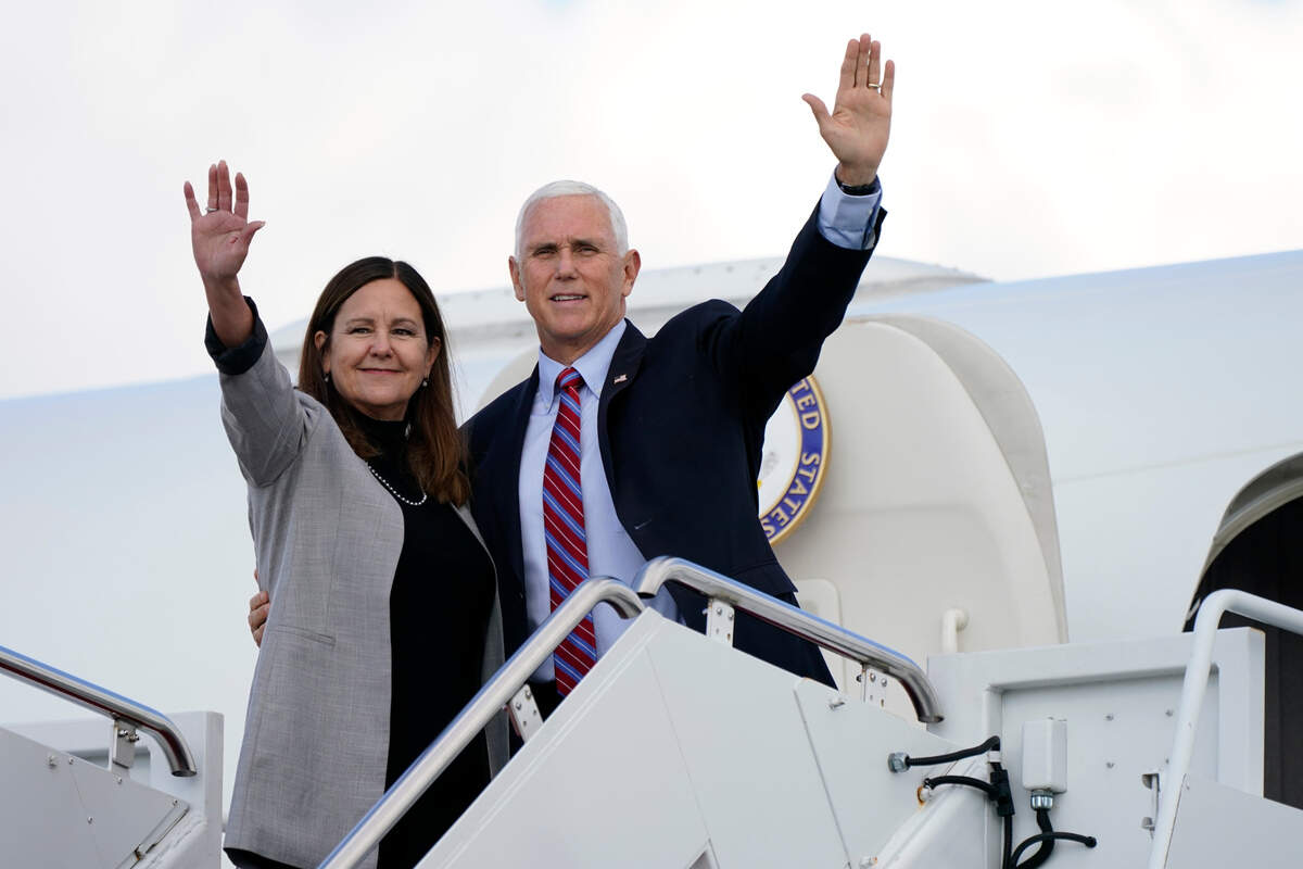Vice President Mike Pence and Karen Pence wave as they board Air Force Two at Andrews Air Force Base, Md., Monday, Oct. 5, 2020, to head to Utah for the vice presidential debate scheduled for Oct. 7. (AP Photo/Jacquelyn Martin)