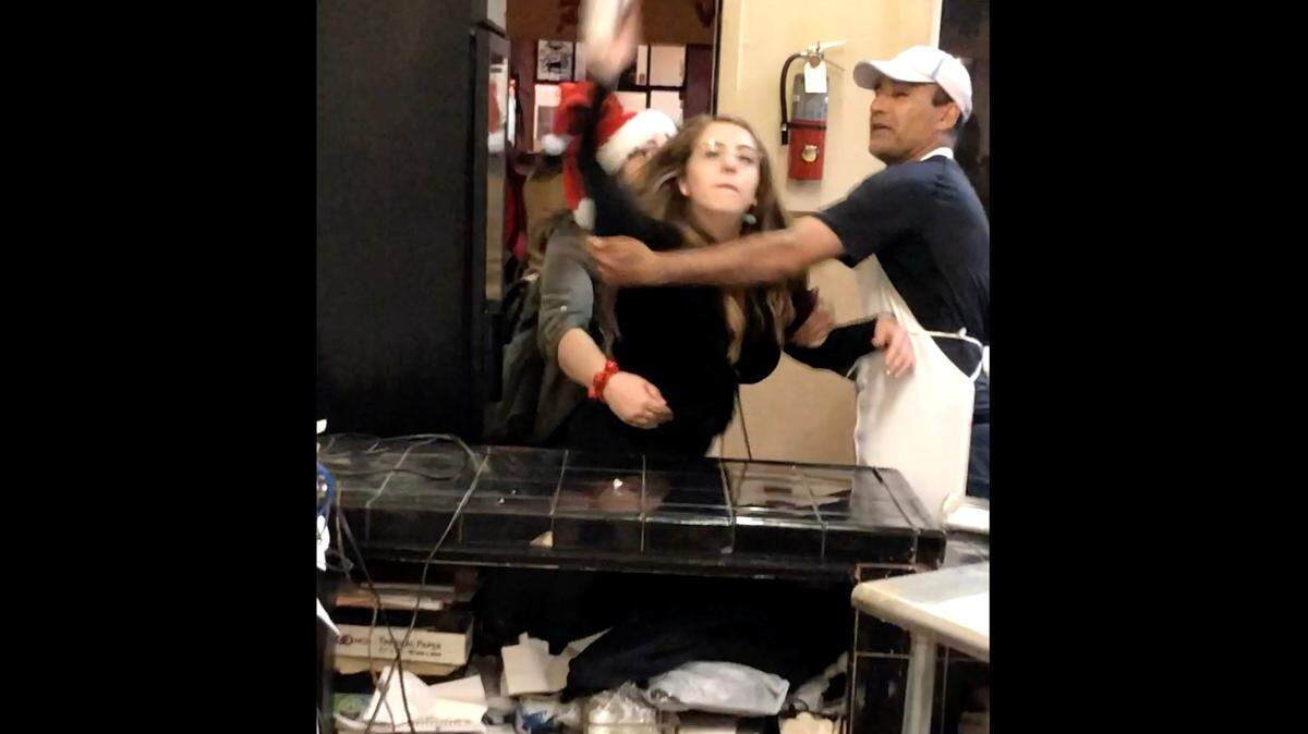 Drunk partiers punched workers at the San Francisco Pakistani restaurant Shalimar, threw a sugar canister and broke a door during the annual Santa Con pub crawl of revelers dressed up as Santa Claus, video shows.