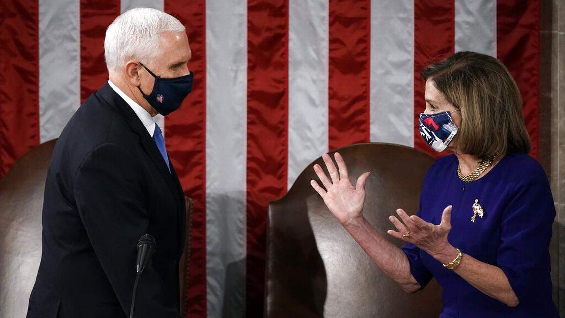 Speaker of the House Nancy Pelosi, D-Calif., and Vice President Mike Pence talk before a joint session of the House and Senate convenes to count the Electoral College votes cast in November’s election, at the Capitol in Washington, Wednesday, Jan. 6, 2021. Pence told Pelosi in a letter he will not invoke the 25th Amendment to remove President Donald Trump. (AP Photo/J. Scott Applewhite)
