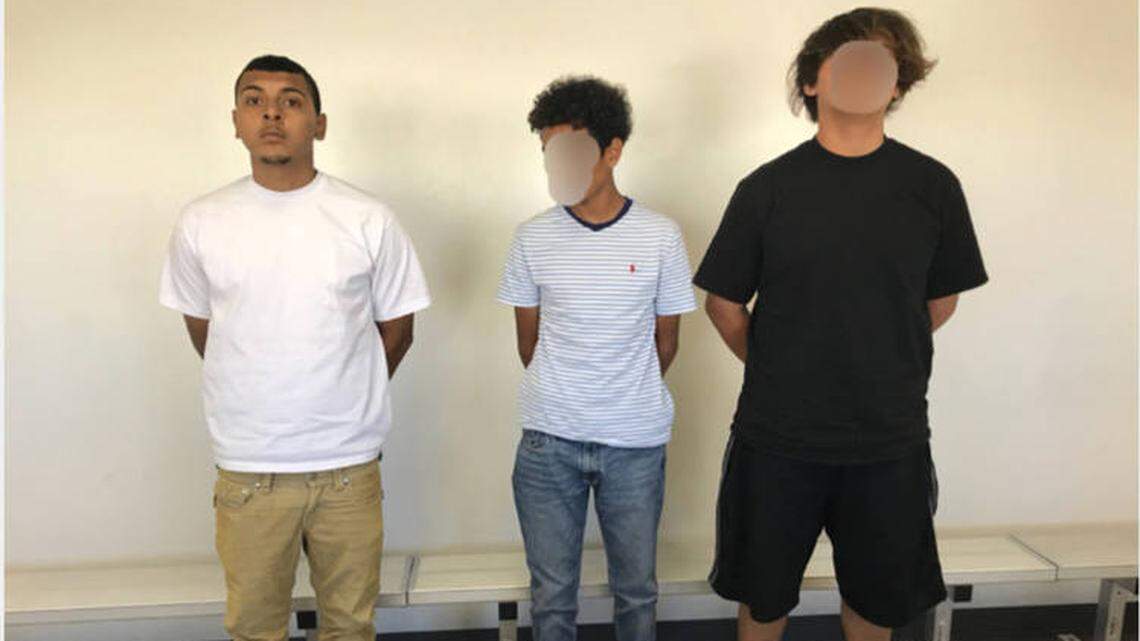 20-year-old Richard Navarrete, left, used the signs to fraudulently seek donations along U.S. Highway 395 on Sept. 17 with two male 14-year-olds, according to the police. The faces of the juveniles in the picture were blurred out by police.