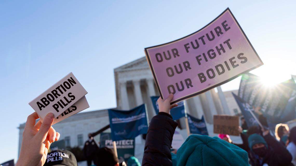 Abortion rights advocates showing a pack of abortion pills demonstrate in front of the U.S. Supreme Court Wednesday, Dec. 1, 2021, in Washington, D.C. As the Supreme Court voted to overturn Roe v. Wade, a majority of people in the U.S. do not want to see the 1973 decision overturned, polls show.