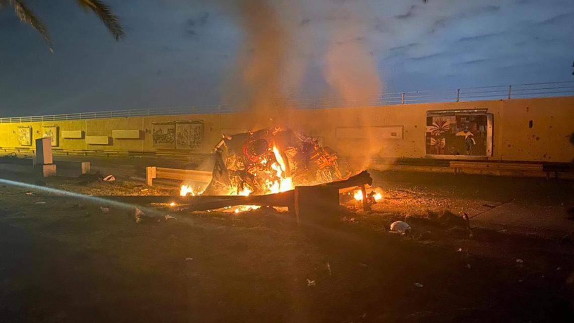 This photo released by the Iraqi Prime Minister Press Office shows a burning vehicle at the Baghdad International Airport following an airstrike in Baghdad, Iraq, early Friday, Jan. 3, 2020.