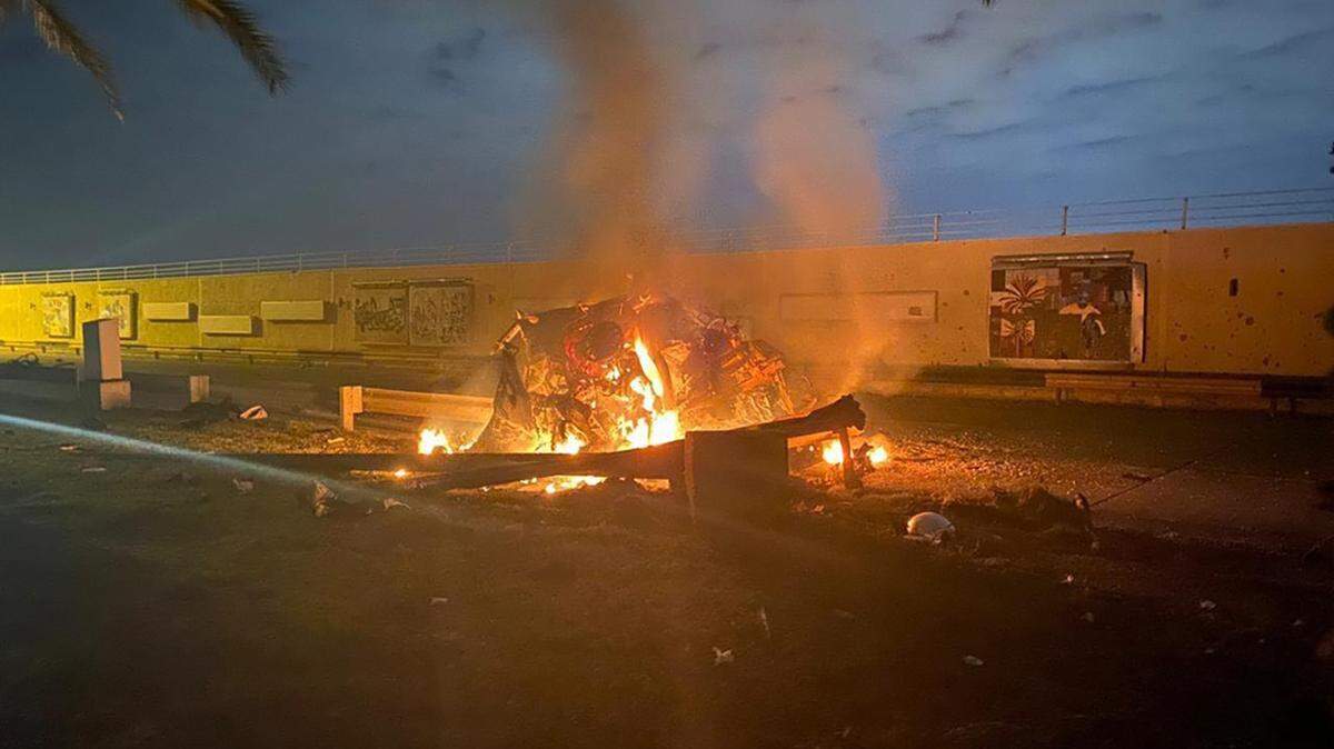 This photo released by the Iraqi Prime Minister Press Office shows a burning vehicle at the Baghdad International Airport following an airstrike in Baghdad, Iraq, early Friday, Jan. 3, 2020.