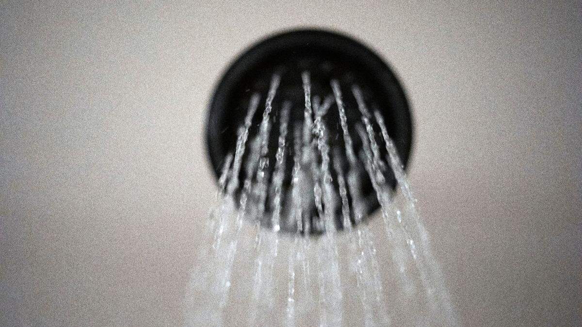 A man was arrested on charges of filming a woman under a shower divider at a recreation center, Virginia police say. (AP Photo/Jenny Kane, File)