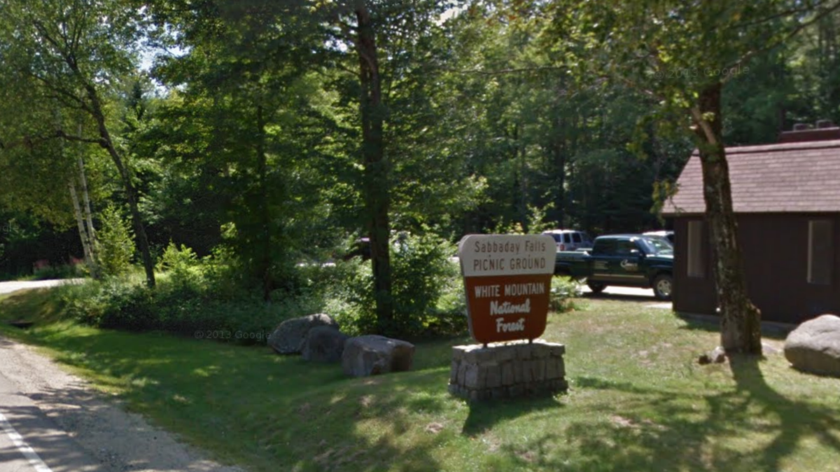 A man fell into a waterfall and became trapped by ice before a “dramatic” rescue, New Hampshire officials said.