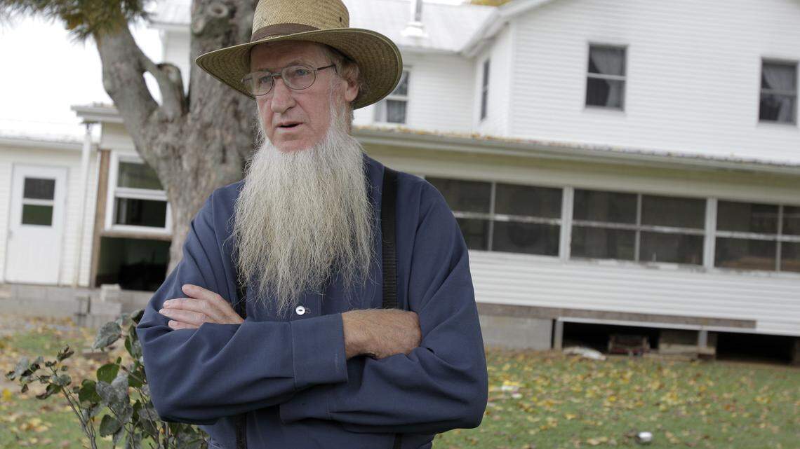 Samuel Mullet Sr. stands in front of his home in Bergholz, Ohio.