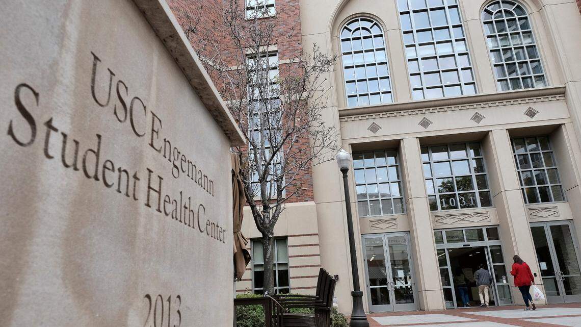 In this May 22, 2018 photo, people enter the University of Southern California’s Engemann Student Health Center in Los Angeles. The University of Southern California has settled a lawsuit with 80 former students, mostly gay and bisexual men, who accused a male doctor of sexual misconduct. The agreement announced Thursday, April 28, 2022, for an undisclosed sum follows settlements by the Los Angeles school to pay more than $1 billion to thousands of women who said they were sexually abused by another male doctor at the student health center. (AP Photo/Richard Vogel, File)