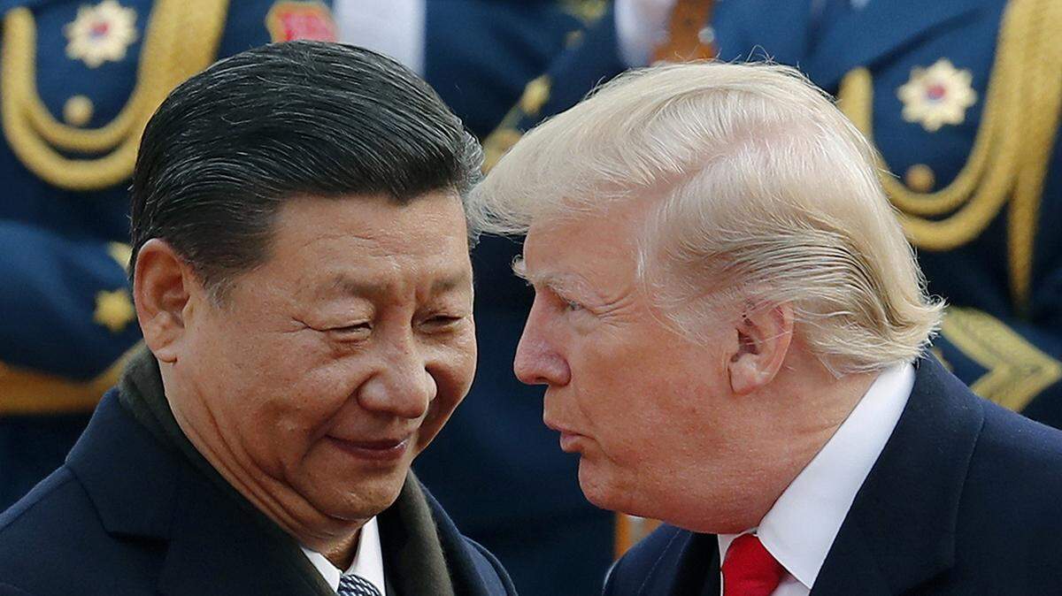 In this Nov. 9, 2017, file photo, U.S. President Donald Trump, right, chats with Chinese President Xi Jinping.