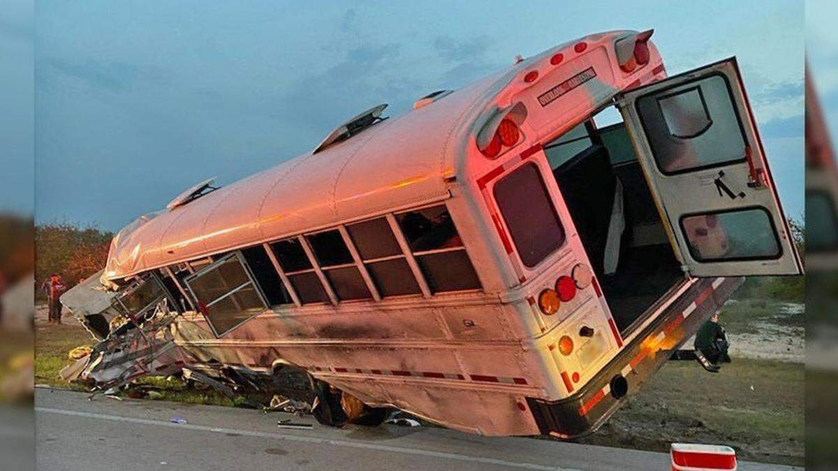 A bus carrying 38 workers crashed head-on with a tanker truck on a highway, Florida police said. One person died at the scene.