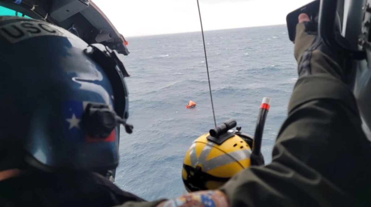 The Coast Guard found the two men after they released a flare, officials say.