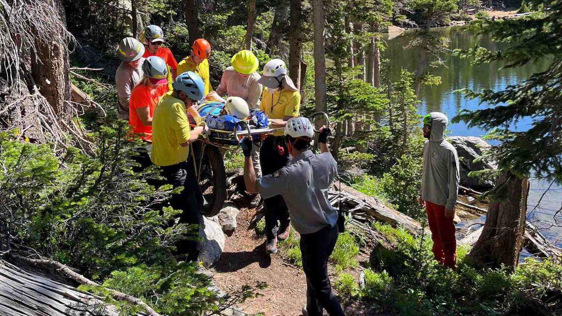 Rocky Mountain National Park rescuers helped a woman into an air ambulance after she was hurt near Odessa Lake.