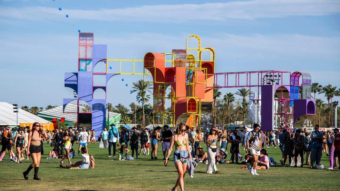 Festivalgoers walk on the grounds at the Coachella Music & Arts Festival at Empire Polo Club on Friday, April 15, 2022, in Indio, Calif. (Photo by Amy Harris/Invision/AP)