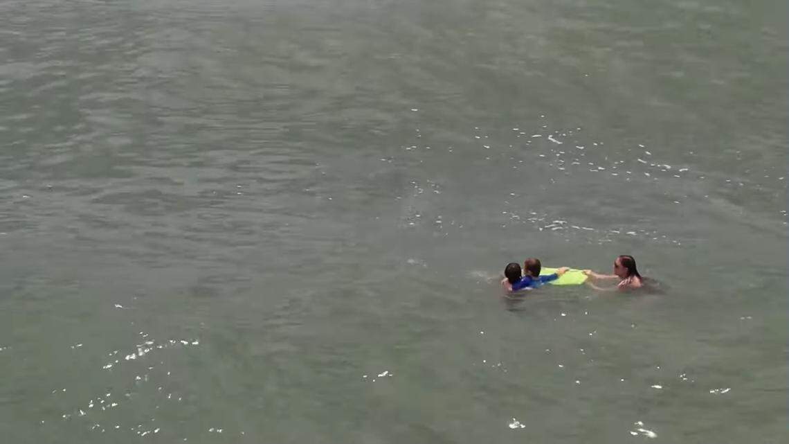 Drone footage shows a teenager from Ohio rescuing a mom and son from a riptide at Topsail Beach on the North Carolina coast over the July 4 holiday weekend.