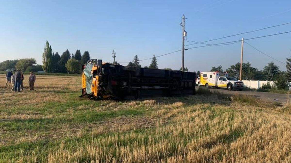 The driver of a pickup died after crashing into a school bus with 40 students on board, Idaho Falls officials said.