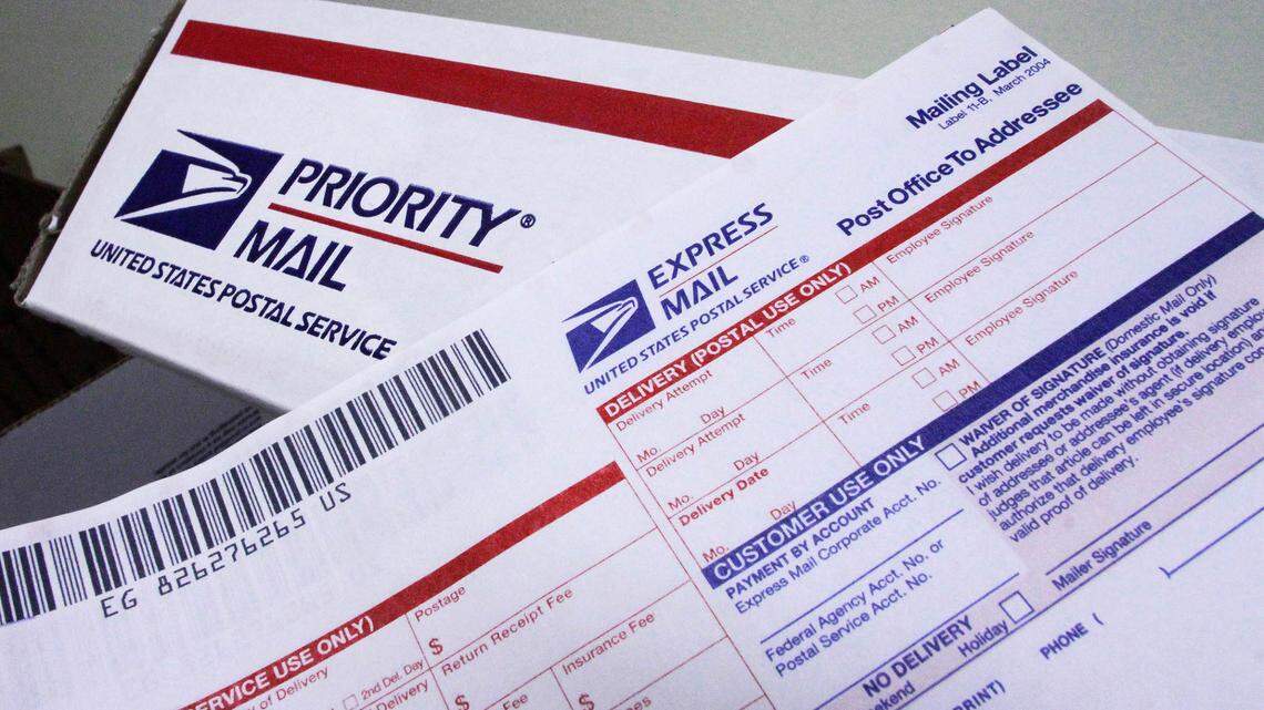 Express mail forms and priority mailboxes sit on display at the Capitol Station, Monday, Dec. 5, 2011, in Springfield, Ill. (AP Photo/Seth Perlman)