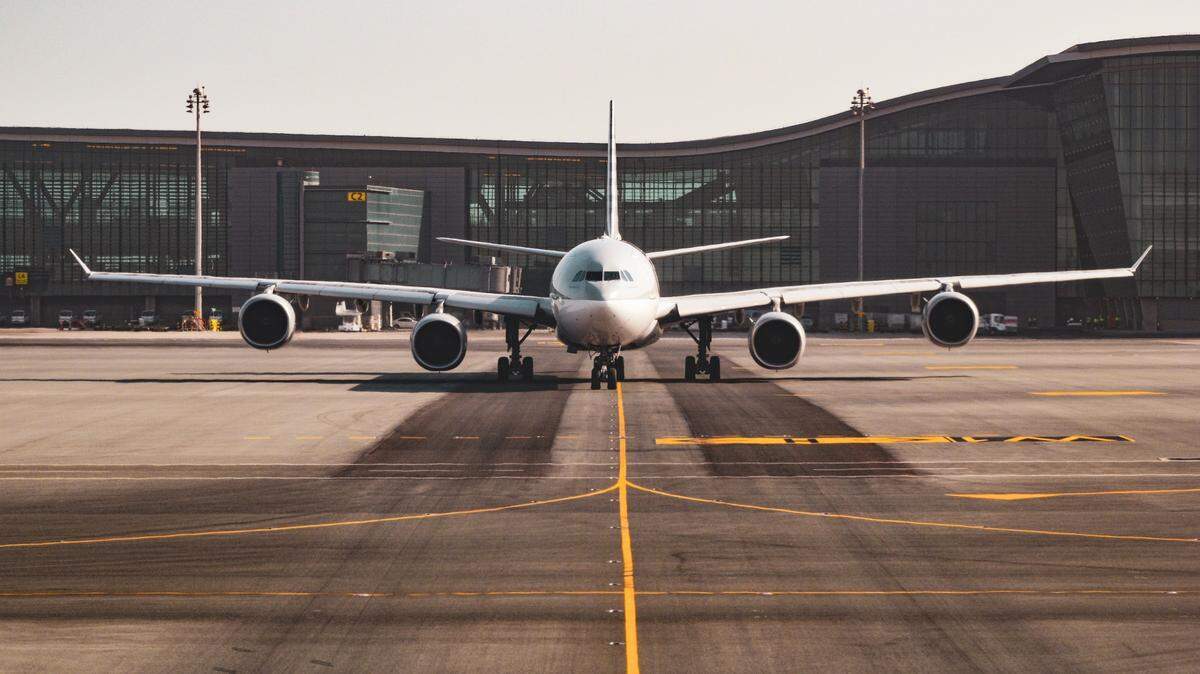 An airport worker is accused of filming people under bathroom stalls, a Florida sheriff says.