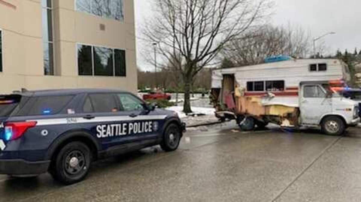 The driver of an RV tried to elude police by going in reverse, Seattle police said.