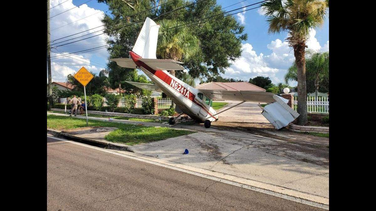 A small plane crashed into the driveway of a home during an emergency landing, according to the Florida Highway Patrol.