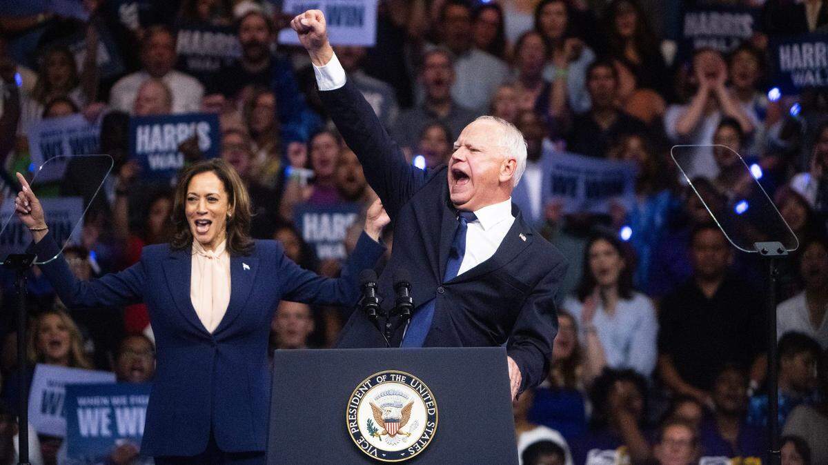 Minnesota Gov. Tim Walz cheers with the crowd after being introduced by Vice President Kamala Harris at a rally at Temple University in Philadelphia on Tuesday, Aug. 6, 2024.