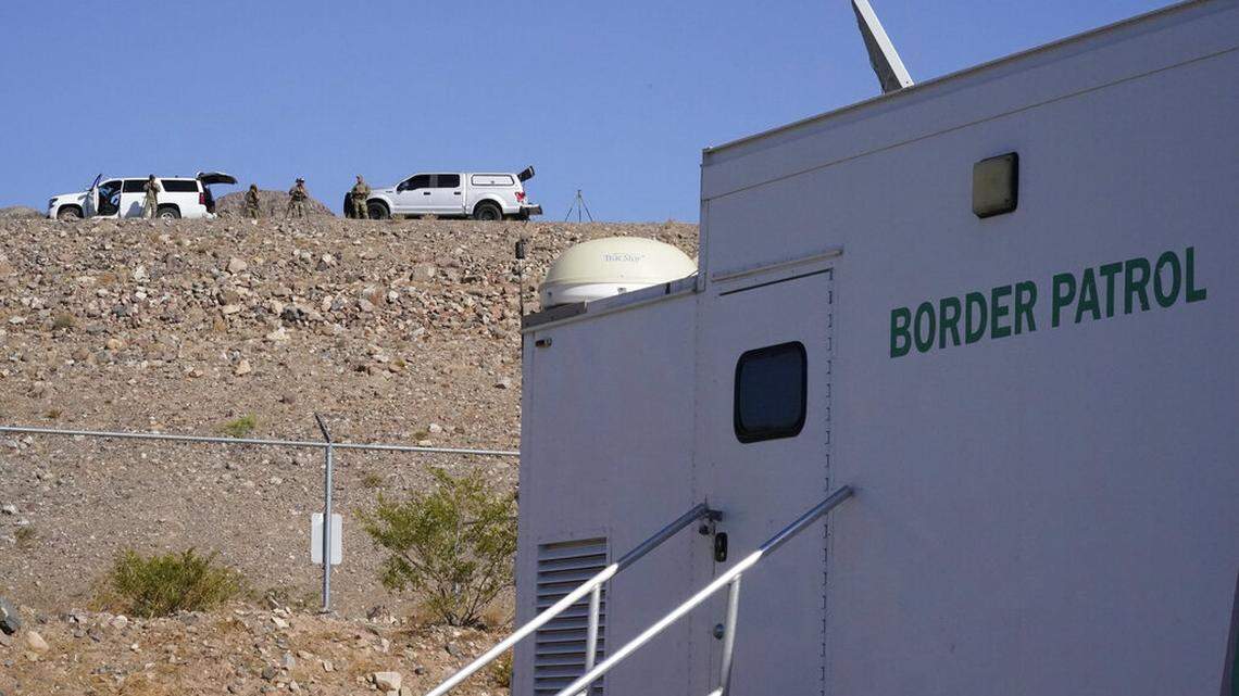 Members of the Border Patrol Tactical Team, keep watch on the border, as Vice President Kamala Harris arrives to tour the U.S. Customs and Border Protection Central Processing Center, Friday, June 25, 2021, in El Paso, Texas. (AP Photo/Jacquelyn Martin)