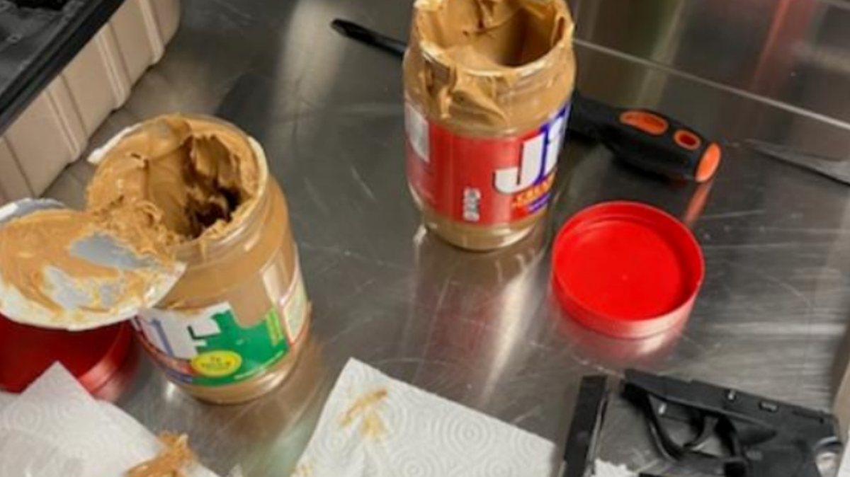 The jars of JIF peanut butter contained a disassembled .22 caliber handgun, officials said. The magazine was loaded.