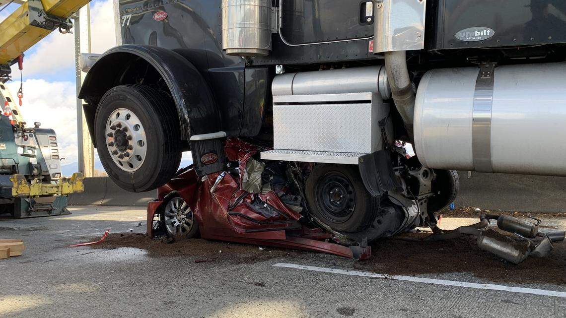 A semi came to a stop crushing a Nissan Altima that was struck from behind and folded in half, Washington State Patrol said.