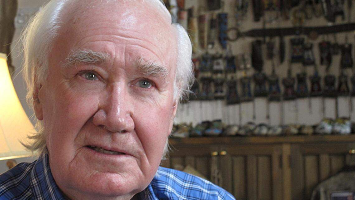 FILE - In this March 22, 2013, file photo, Forrest Fenn sits in his home in Santa Fe, N.M. A French treasure hunter has sued the estate of the New Mexico antiquities dealer who sparked a yearslong search by hiding a chest filled with gold, coins and other valuables. Bruno Raphoz is seeking $10 million in a U.S. complaint filed last week. He says the late Forrest Fenn deprived him of the riches by moving the treasure chest after he solved a riddle that would lead him to the loot. (AP Photo/Jeri Clausing,File)