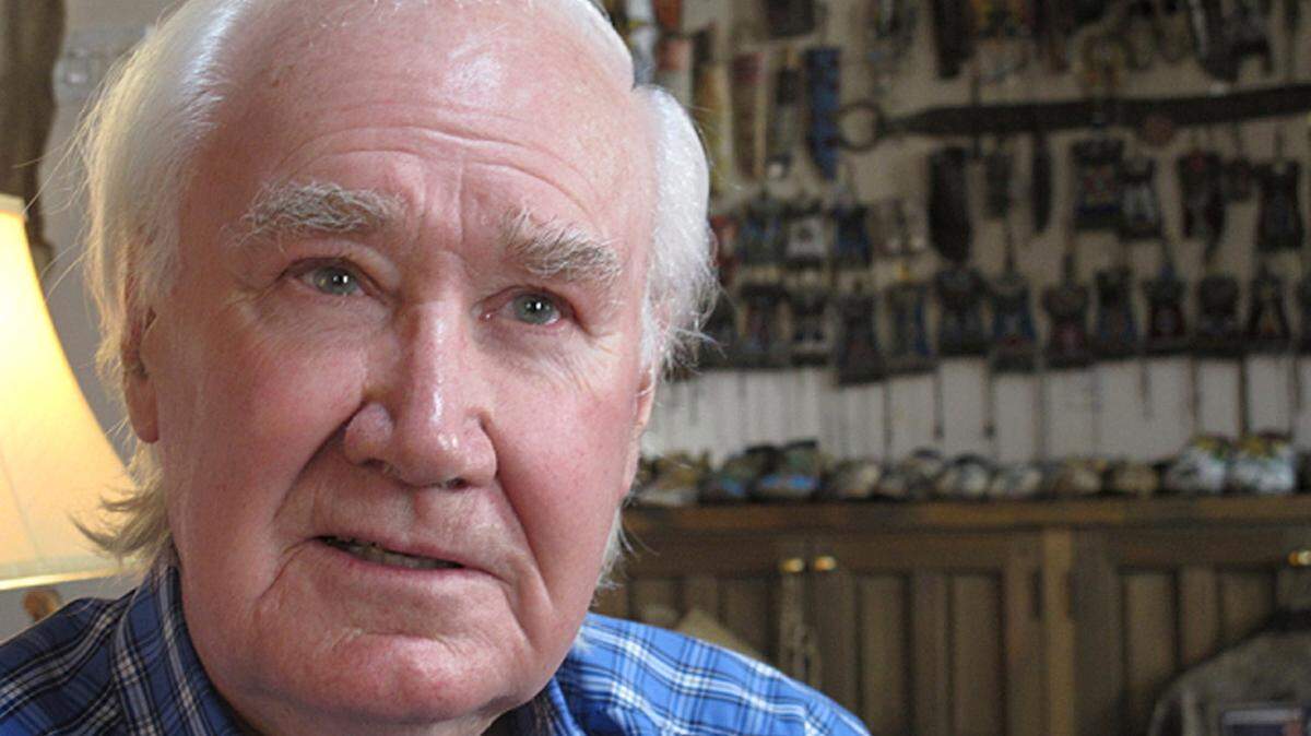 FILE - In this March 22, 2013, file photo, Forrest Fenn sits in his home in Santa Fe, N.M. A French treasure hunter has sued the estate of the New Mexico antiquities dealer who sparked a yearslong search by hiding a chest filled with gold, coins and other valuables. Bruno Raphoz is seeking $10 million in a U.S. complaint filed last week. He says the late Forrest Fenn deprived him of the riches by moving the treasure chest after he solved a riddle that would lead him to the loot. (AP Photo/Jeri Clausing,File)