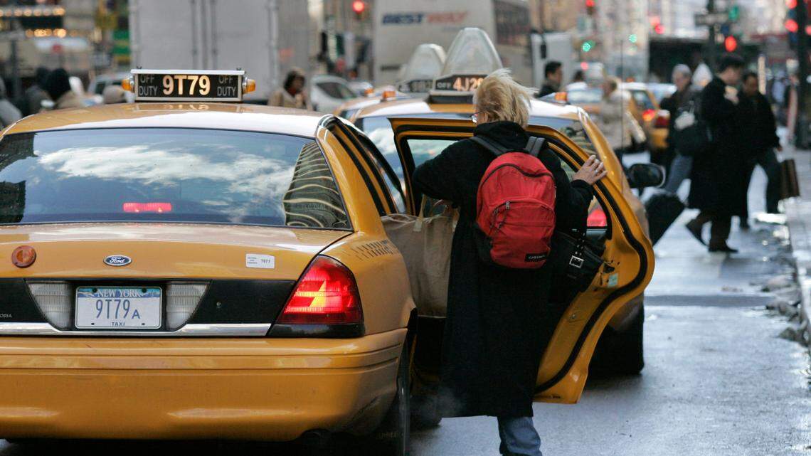 A woman gets into a taxi outside Penn Station in New York in January 2008. A South Carolina man was sentenced to six years in prison after prosecutors said he used a taxi to attempt to rob a bank drive-thru in Hartsville.