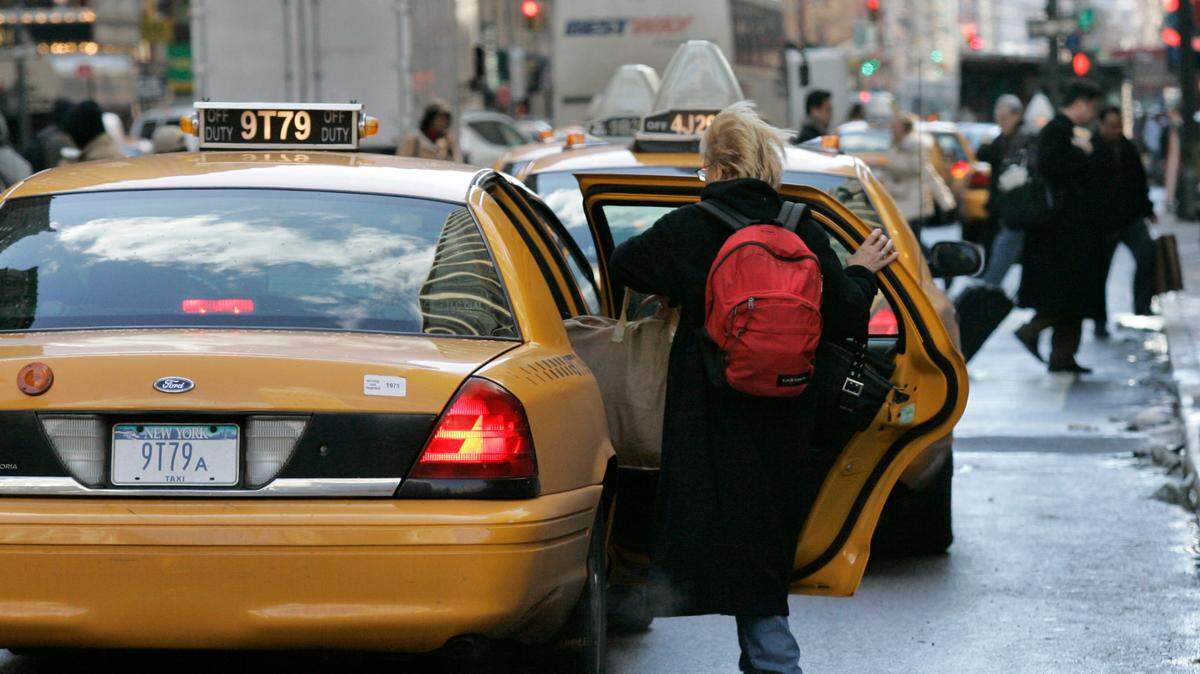 A woman gets into a taxi outside Penn Station in New York in January 2008. A South Carolina man was sentenced to six years in prison after prosecutors said he used a taxi to attempt to rob a bank drive-thru in Hartsville.