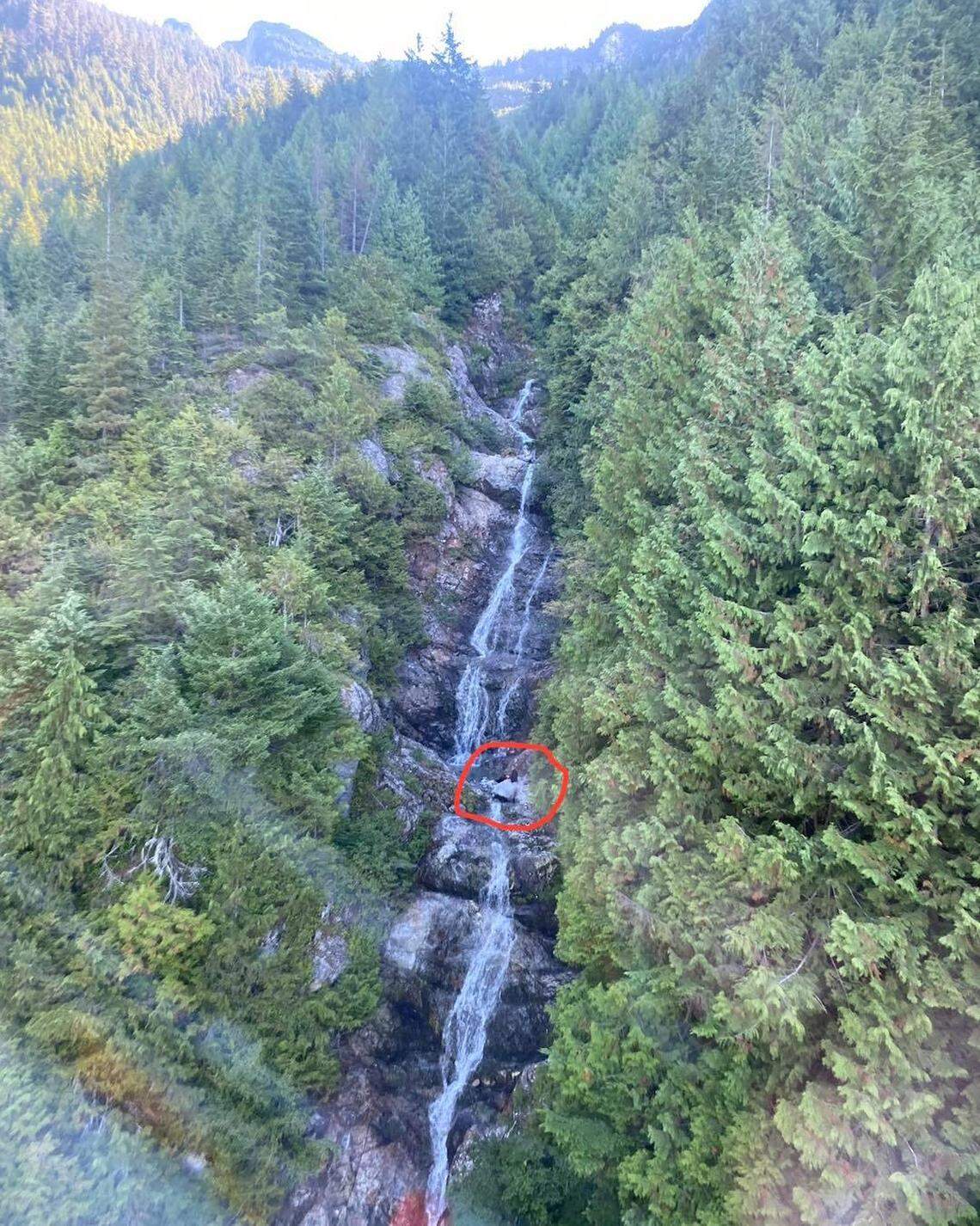Rescuers found the hiker in the middle of the waterfall. 