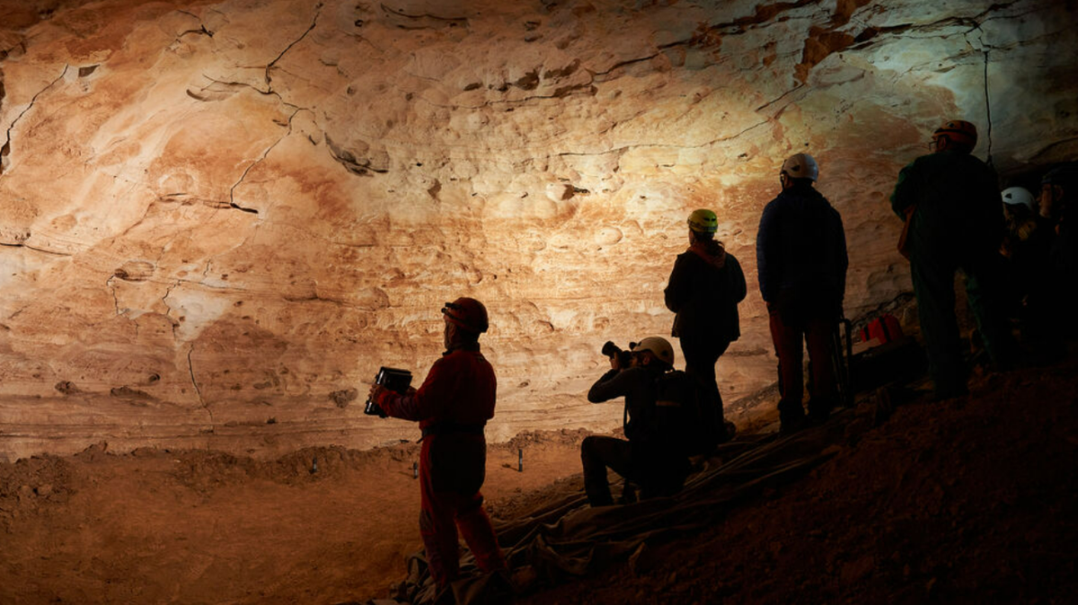 A team of cave explorers discovered a prehistoric mural depicting animals and stars in northeastern Spain.