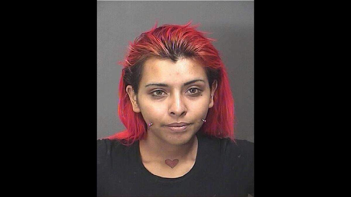 Abigail Martinez, 23, was arrested Monday after stabbing a police dog under each eye with an eyebrow trimmer, say police in Baytown, Texas.