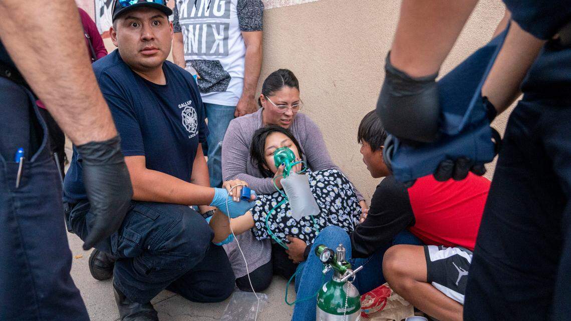 A girl is treated for shock near the intersection of South Second Street and Historic Highway 66 after an SUV careened through the parade route of the Intertribal Ceremonial Centennial Celebration in Gallup, New Mexico, Thursday, Aug. 4. 2022.