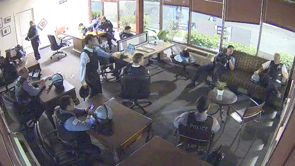FILE - This file still image taken from security video released by the Congressman Bobby Rush’s Campaign Office shows Chicago police inside Rush’s burglarized congressional campaign office in Chicago on Sunday, May 31, 2020. Chicago Police suspended several officers captured on video during 2020’s widespread unrest who were lounging, and apparently even sleeping, inside a burglarized congressional campaign office as people citywide vandalized and stole from businesses, a police union official said, Thursday, Jan. 14, 2021. (Congressman Bobby Rush’s Campaign Office via AP, File)