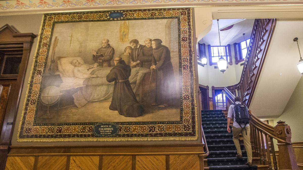 This 2017 photo shows a murals of Christopher Columbus at Notre Dame in South Bend, Indiana. The University of Notre Dame will cover murals in a campus building that depict Christopher Columbus in America, the school’s president said, following criticism that the images depict Native Americans in stereotypical submissive poses before white European explorers.
