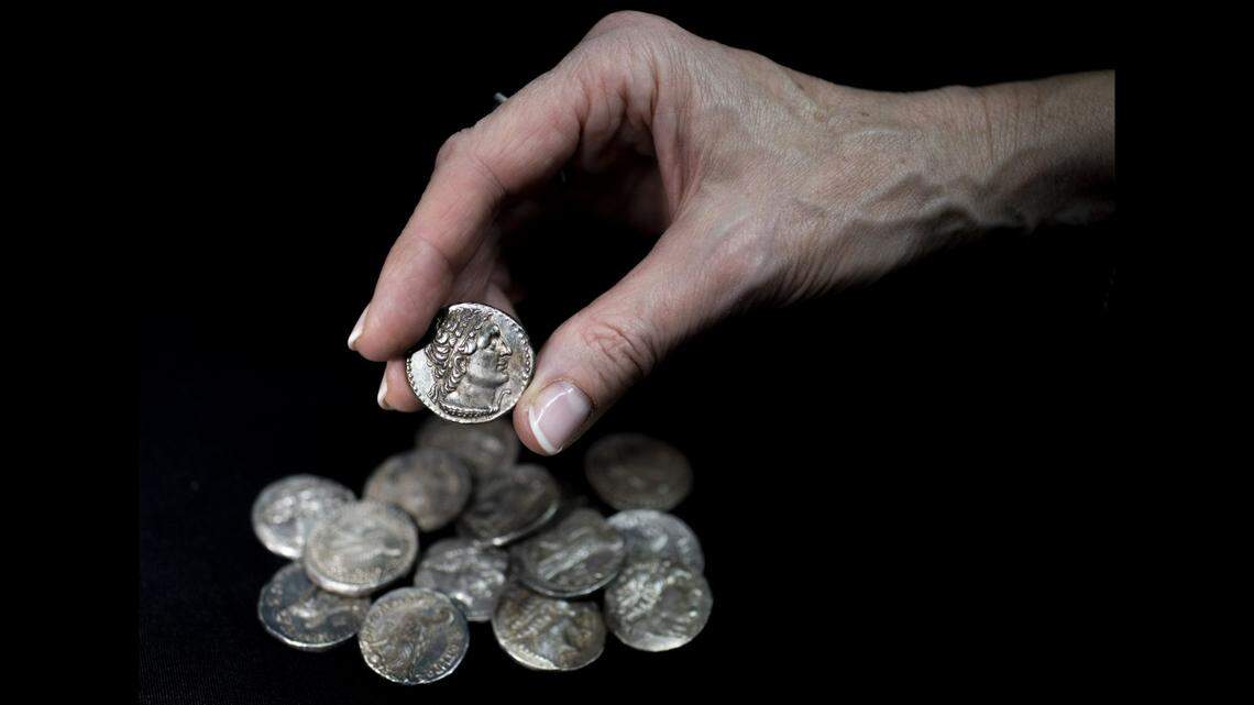 Fifteen 2,200-year-old coins were found in the box.