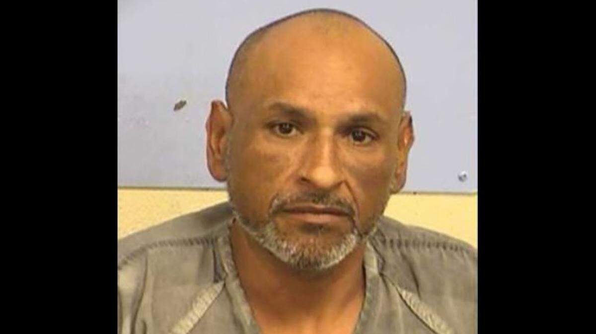 Armando Martinez, 43, was arrested by Austin police Tuesday after they say they recovered 138 pounds of meth, cocaine and heroin from the wheel well of the pickup truck he was driving.