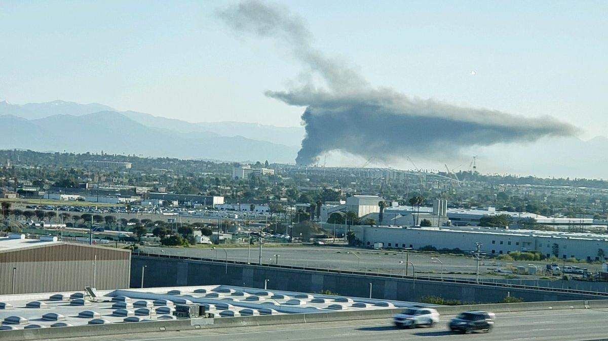 Photos posted by the Los Angeles Fire Department on Twitter show the smoke from a distance on Sunday morning.