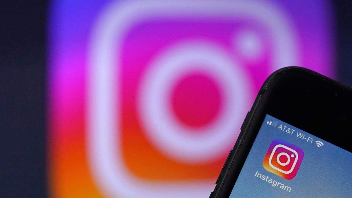 An Instagram logo is shown on an iPhone screen, Friday, Feb. 5, 2021, in Derry, N.H. Some Instagram filters were banned in Texas after the state’s attorney general accused the app of collecting sensitive data without users’ permission. (AP Photo/Charles Krupa)