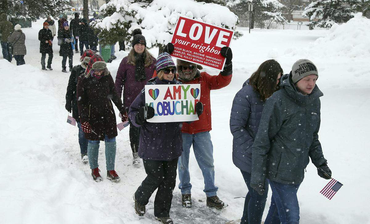 Snow falls as rally goers arrive at Boom Island Park for Democratic Sen. Amy Klobuchar’s announcement of her decision in the race for president at a rally Sunday, Feb. 10, 2019, at Boom Island Park in Minneapolis. (AP Photo/Jim Mone)