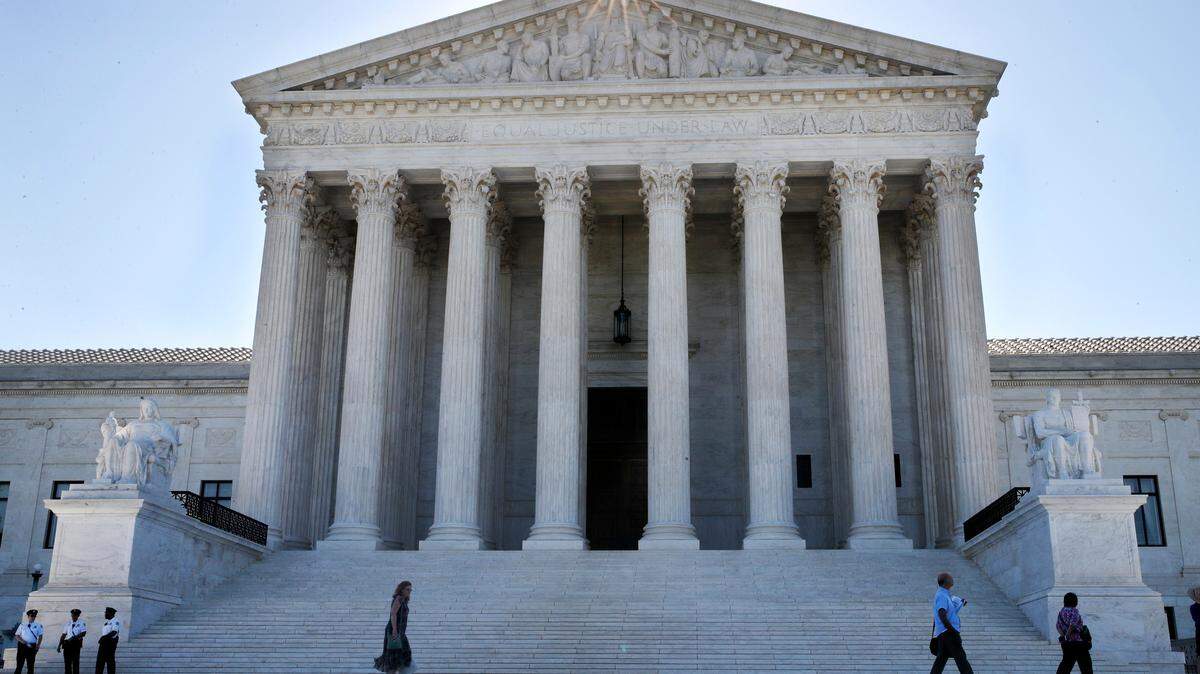 The sun flares above the Supreme Court, Monday, July 9, 2018, in Washington.